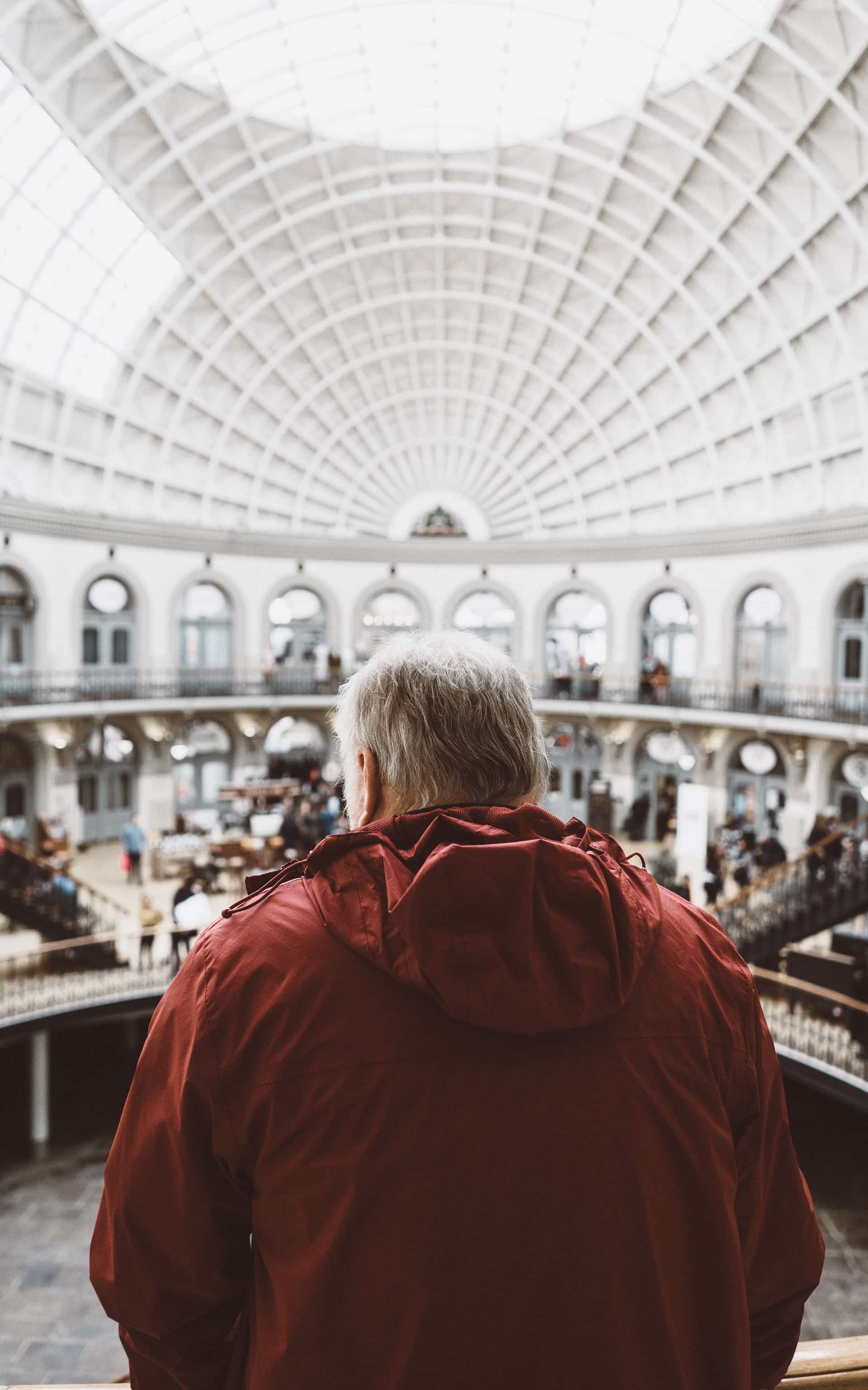 Elderly visitor enjoying the museum exhibits